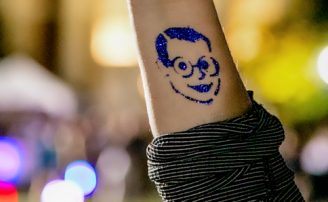 forearm with duke blue president price tattoo