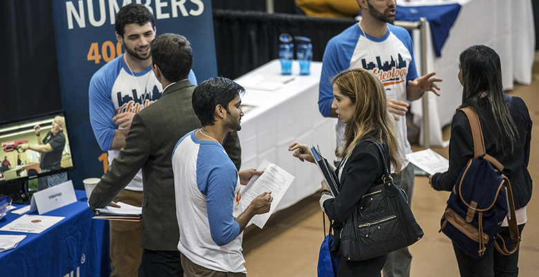 people speaking to one another at the duke career center